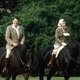 Королева Елизавета на лошади Бурмис. Слева - 40й президент США Рональд Рейган.